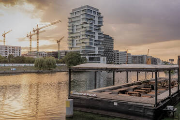 View of the Spree River after sunrise in Berlin with modern buildings in the background, Berlin, Germany, Europe - RHPLF09474