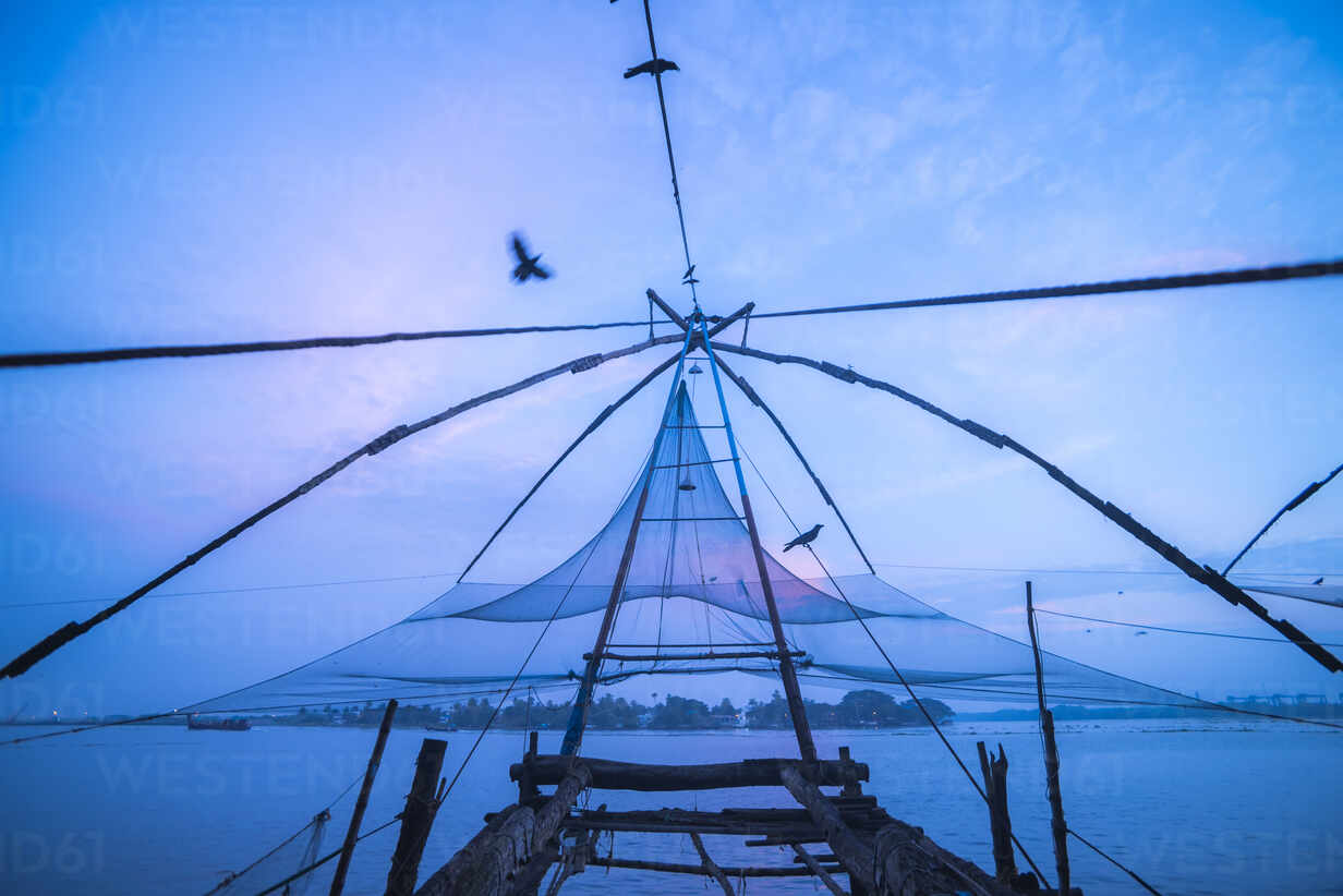Traditional Chinese fishing nets at dawn, Fort Kochi (Cochin), Kerala, India,  Asia stock photo