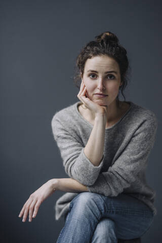 Portrait of pensive young woman stock photo