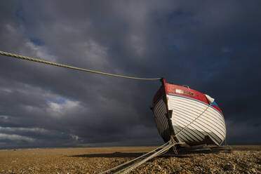 Boat on shingle beach, Dungeness, Kent, England, United Kingdom, Europe - RHPLF10013