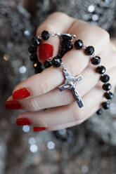Catholic woman praying rosary beads and crucifix, Vietnam, Indochina, Southeast Asia, Asia - RHPLF10084