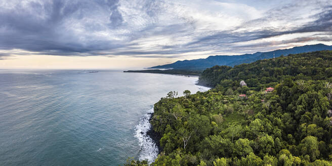 Drone view of Arco Beach and rainforest at sunrise, Uvita, Puntarenas Province, Pacific Coast of Costa Rica, Central America - RHPLF10108