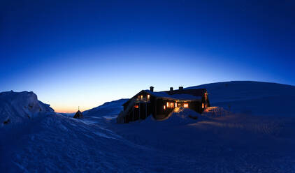 Illuminated house at winter - JOHF00382