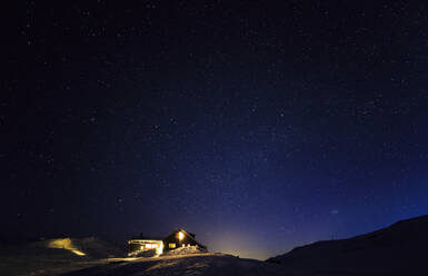 Illuminated house at winter - JOHF00386