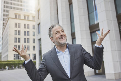 Portrait of happy businessman in the city - RORF01897