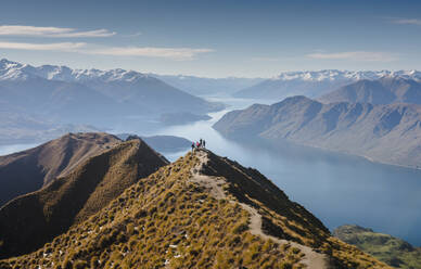 Hikers enjoying the view from the Roys Peak hiking trail near Wanaka, Otago, South Island, New Zealand, Pacific - RHPLF10438
