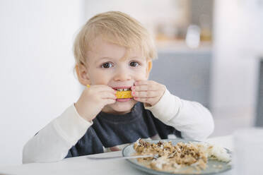 Boy eating meal - JOHF00423