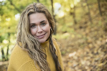 Young woman in autumn forest - JOHF00429