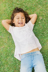 Portrait of girl lying on grass - JOHF00471