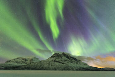Northern Lights (Aurora borealis) on frozen lake Skoddebergvatnet, Grovfjord, Troms county, Lofoten Islands, Nordland, Norway, Europe - RHPLF10590