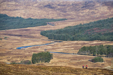 Hiking along The West Highland Way between Bridge of Orchy and Inveroran in the Scottish Highlands, Scotland, United Kingdom, Europe - RHPLF10609