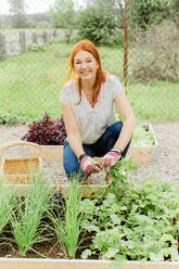 Woman working in garden - JOHF00509