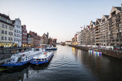 Hanseatic League houses on the Motlawa River at sunset in the pedestrian zone of Gdansk, Poland, Europe - RHPLF10827