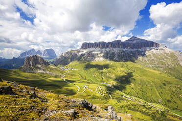 Pordoi Pass road with Sella Group and Sassolungo group, Pordoi Pass, Fassa Valley, Trentino, Dolomites, Italy, Europe - RHPLF10929