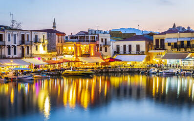 Old Venetian harbour, taverns on seaside at dusk, Rethymno (Rethymnon), Crete, Greek Islands, Greece, Europe - RHPLF11086