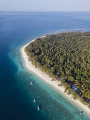 Drone shot of Gili Meno island against clear sky at Bali, Indonesia - KNTF03423