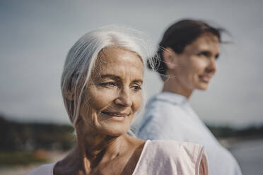 Mother and daughter spending a day at the sea, portrait - JOSF03655