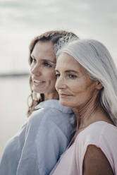 Mother and daughter spending a day at the sea, portrait - JOSF03659