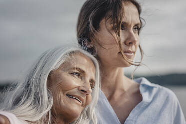 Mother and daughter spending a day at the sea, portrait - JOSF03668