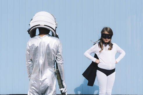 Two kids in astronaut and superhero costumes - DAMF00046