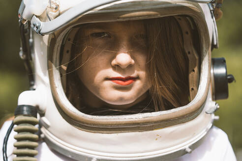 Portrait of girl wearing space helmet - DAMF00050