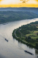 Aerial view of cruise ships on Rhine river against sky during sunset, Germany - RUNF03159