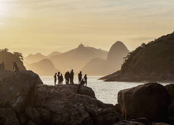View over rocks of Piratininga towards Rio de Janeiro, sunset, Niteroi, State of Rio de Janeiro, Brazil, South America - RHPLF11481