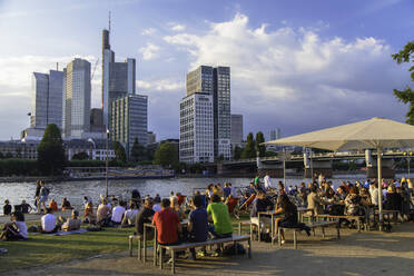 People sitting at outdoor bar beside River Main, Frankfurt, Hesse, Germany, Europe - RHPLF11522
