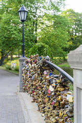 Lovers Locks on Bridge, Bastejkalnna Parks, Riga, Latvia, Europe - RHPLF11628