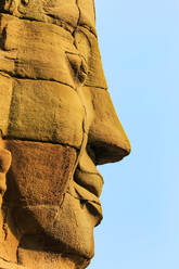 One of 216 smiling sandstone faces at 12th century Bayon, King Jayavarman VII's last temple in Angkor Thom, Angkor, UNESCO World Heritage Site, Siem Reap, Cambodia, Indochina, Southeast Asia, Asia - RHPLF11851