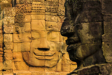 Two of 216 smiling sandstone faces at 12th century Bayon, King Jayavarman VII's last temple in Angkor Thom, Angkor, UNESCO World Heritage Site, Siem Reap, Cambodia, Indochina, Southeast Asia, Asia - RHPLF11852