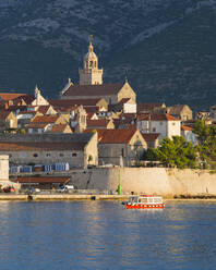 View to the Old Town at sunrise, ferry sailing into harbour, Korcula Town, Korcula, Dubrovnik-Neretva, Dalmatia, Croatia, Europe - RHPLF11931