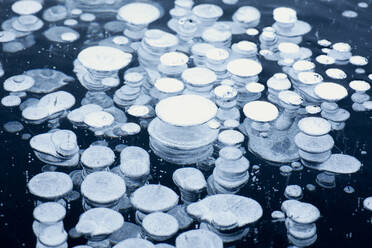 Close up of circular ice bubbles, Lake St Moritz, Engadine, Canton of Graubunden, Switzerland, Europe - RHPLF11959