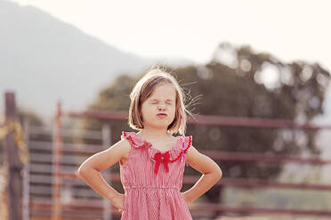 Portrait of little girl with eyes closed pouting mouth - XCF00225