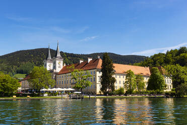 View of Tegernsee Abbey and St. Quirinus Church against blue sky during sunny day, Bavaria, Germany - LHF00721