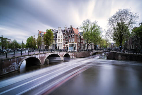 Netherlands, Amsterdam, Light trails along city canal - XCF00229