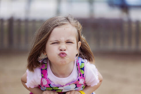 Portrait of little girl pouting mouth - XCF00244
