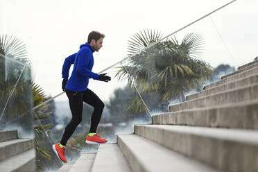 Jogger running on steps - JSRF00636