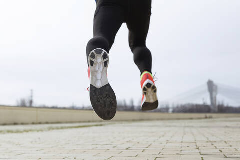 Jogger running, runner's feet, sole of shoe stock photo