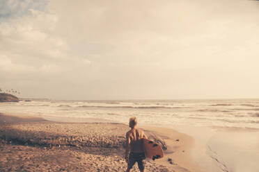 Surfer on beach - JOHF01103