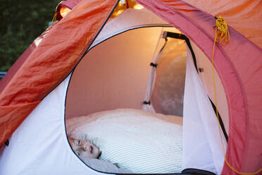 Girl sleeping in tent - JOHF01170