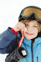 Boy holding medal - JOHF01247