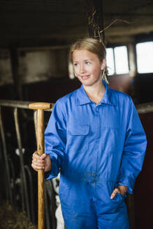 Woman in cowshed - JOHF01335