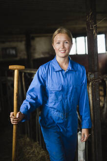 Woman in cowshed - JOHF01336