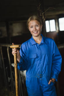 Portrait of woman in barn - JOHF01414