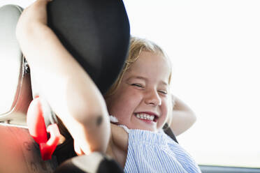 Smiling girl in car - JOHF01433