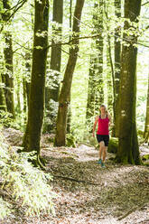 Woman jogging in forest - JOHF01746