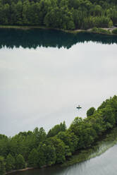 Trees at lake, aerial view - JOHF01921