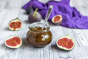 Sliced figs and jar of homemade fig jam - SARF04353