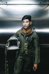 Man posing dressed as an astronaut in an elevator - DAMF00101